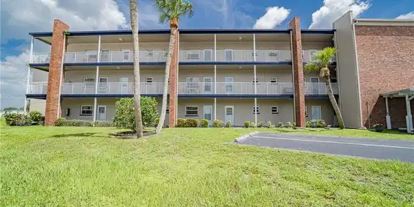 Image 3: View of apartment building / complex with uncovered parking