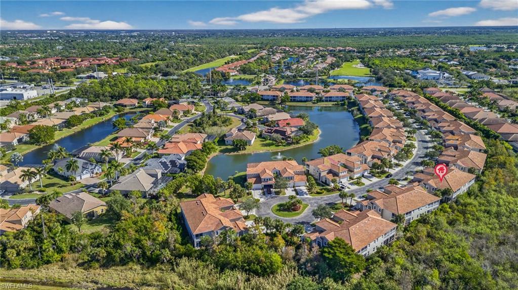 Image 2: View of property location featuring a nearby body of water and nearby suburban area