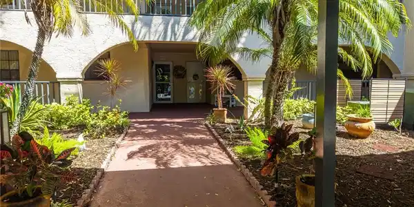 Image 3: Entrance to property with stucco siding