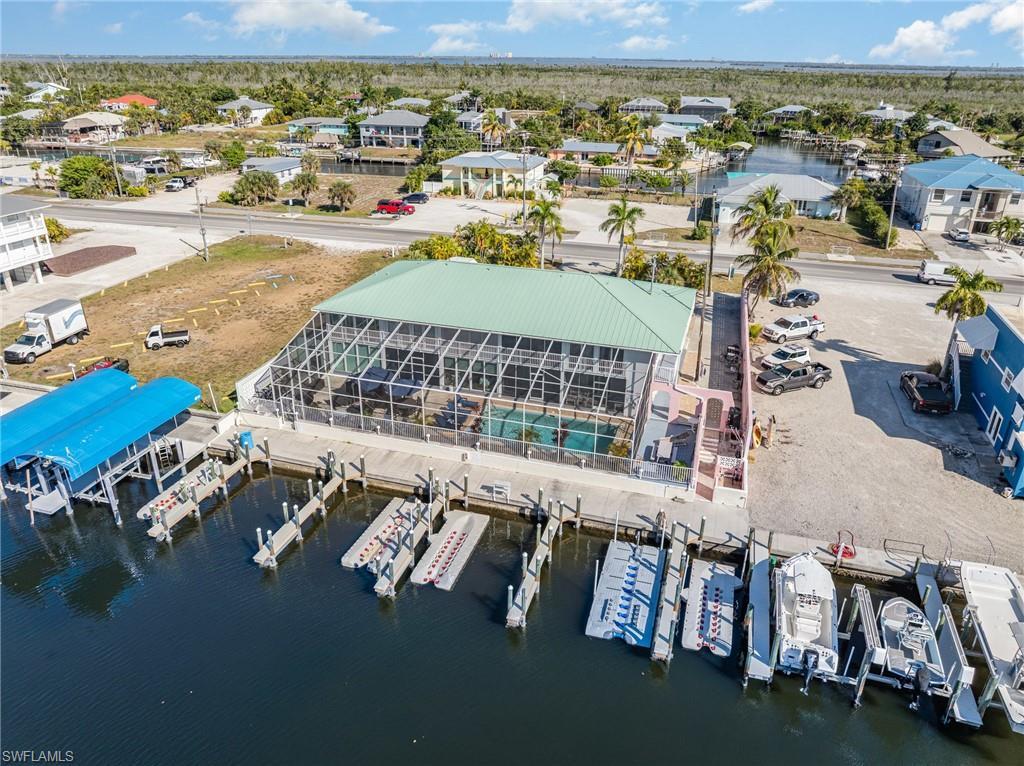 Image 2: Bird's eye view of waterfront and exterior back of building