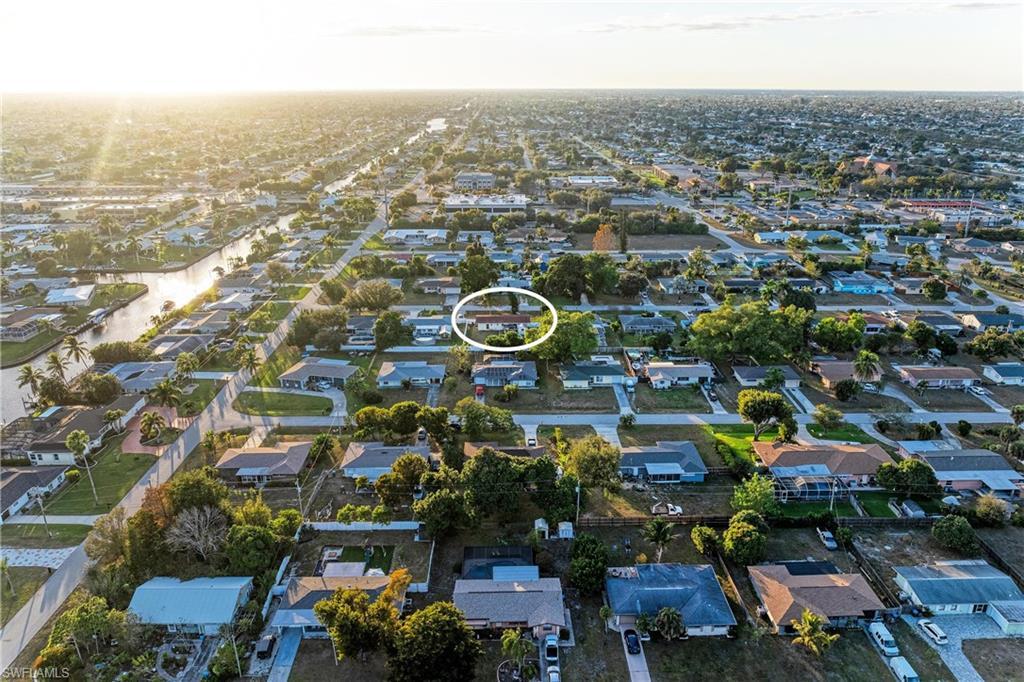 Image 2: Aerial view of property's location featuring nearby suburban area