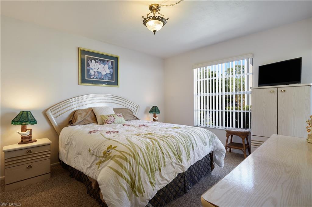 Image 3: Bedroom featuring carpet flooring