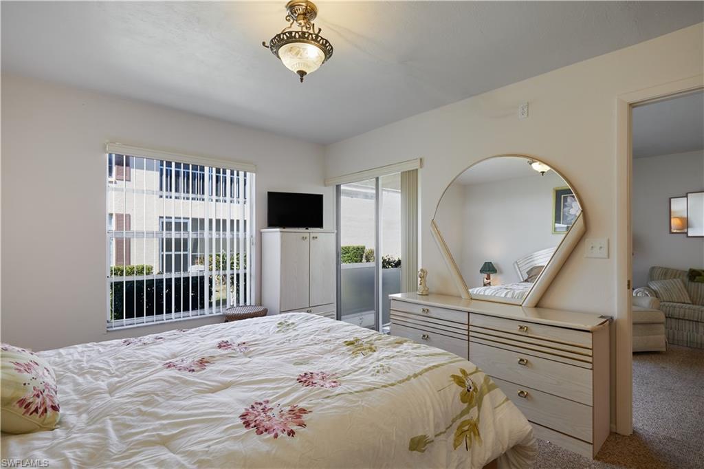 Image 4: Bedroom featuring light carpet
