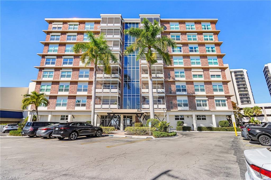 Image 4: View of apartment building / complex with uncovered parking