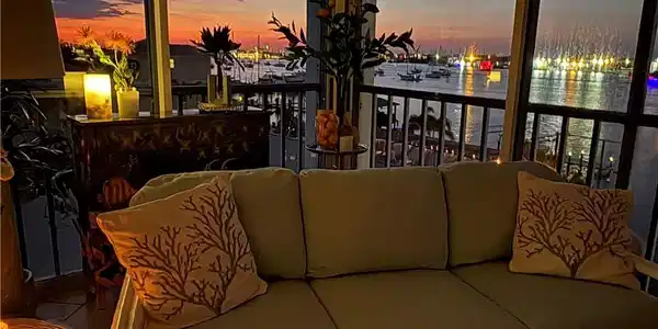 Image 2: Sunset from your Lanai and the lights across the Bay!