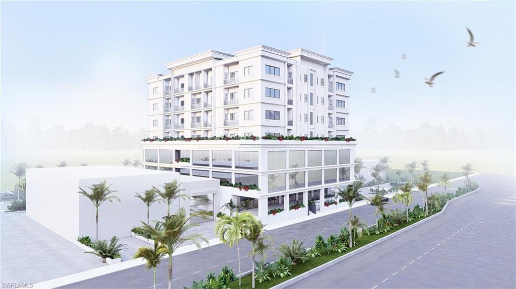 Image 3: View of apartment building / complex with a water view