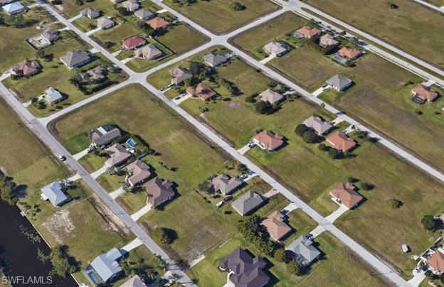 Image 4: Aerial view of property's location featuring nearby suburban area