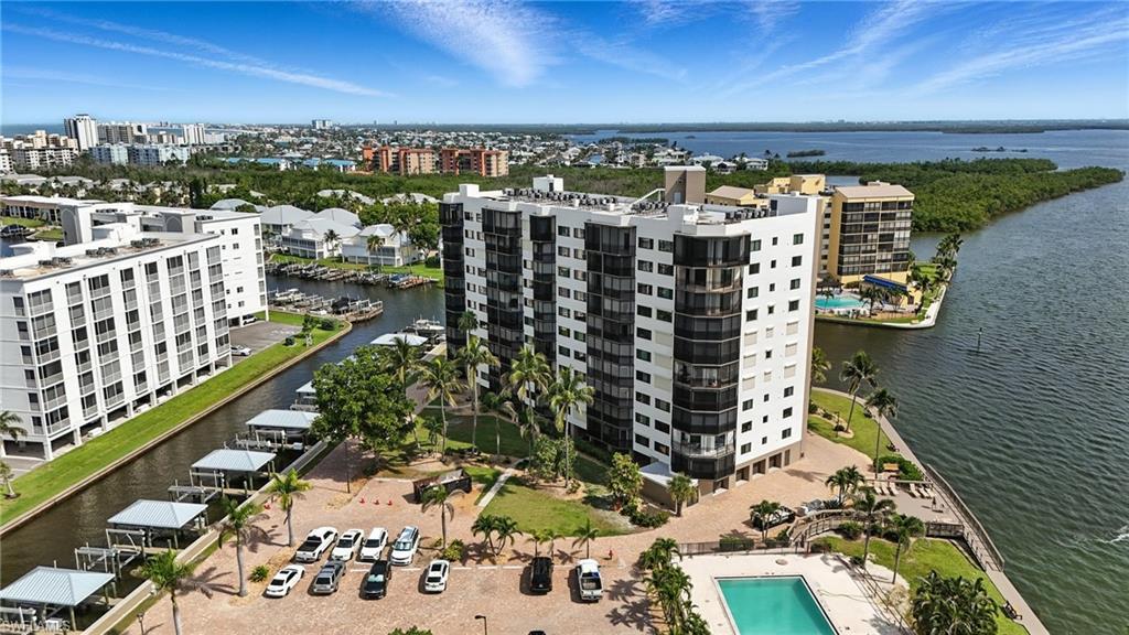 Image 2: View of urban area featuring a large body of water