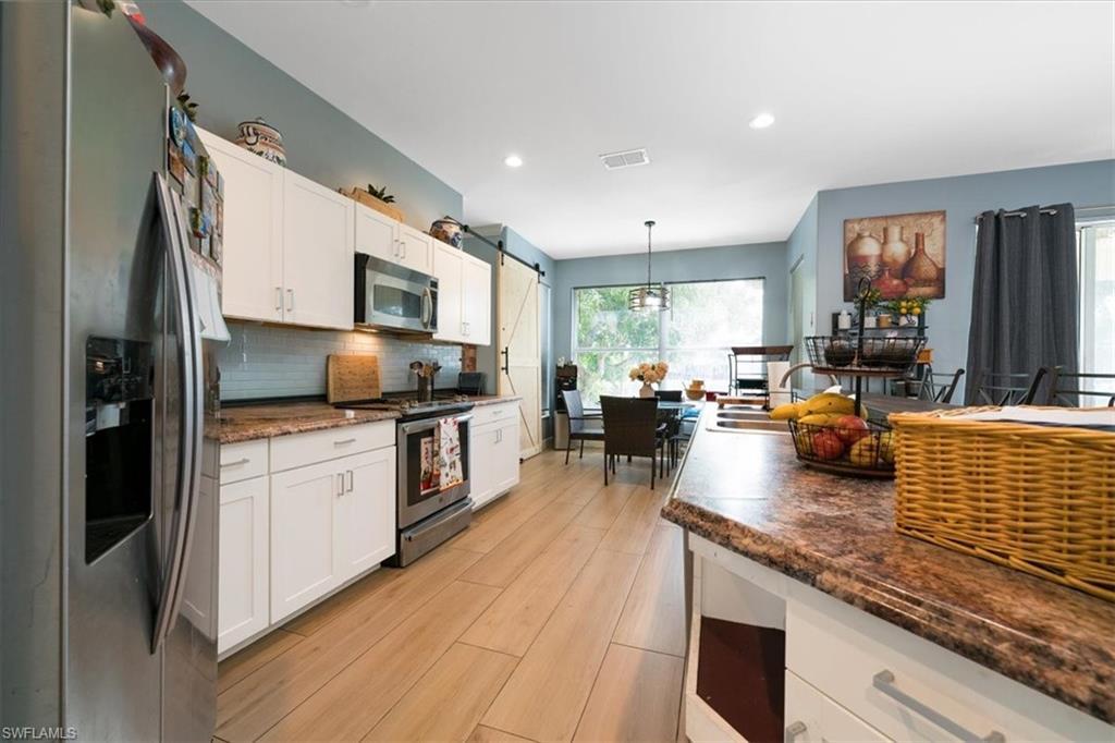 Image 4: Large Kitchen with white shaker cabinetry