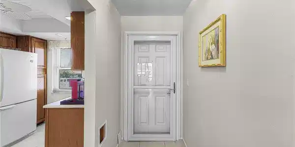 Image 2: Entryway with tile floor and a textured ceiling