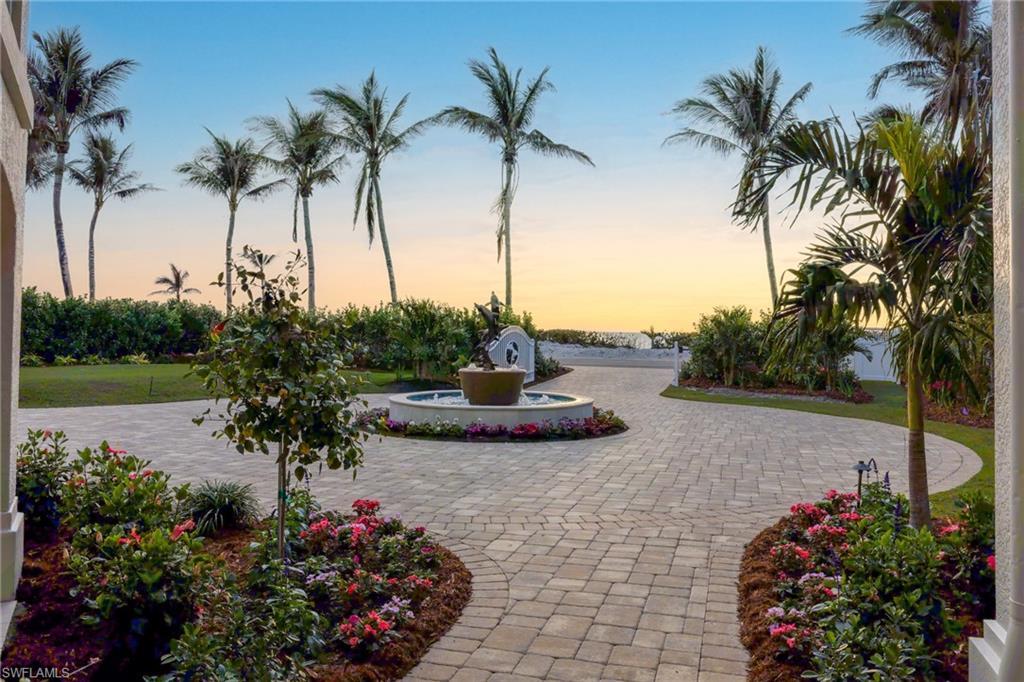 Image 3: Gorgeous Front Entry with Electric Gate and custom Dolphins Fountain