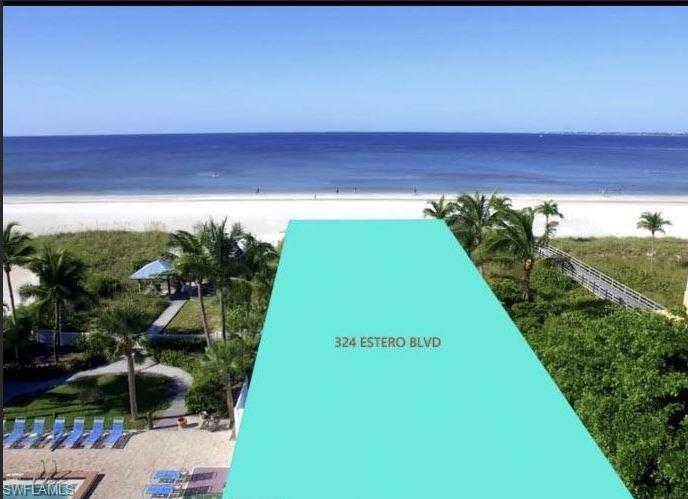 Image 4: View of property's community with a water view and a view of the beach
