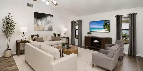 Image 3: Photo include Reality Staging to showcase the potential of the living room. Design services included with purchase!