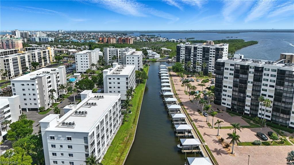 Image 4: View of urban area with a large body of water