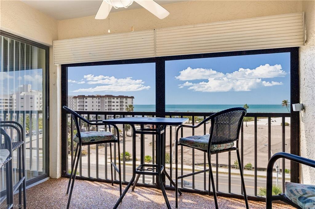 Image 2: Unfurnished sunroom with a water view and a textured wall