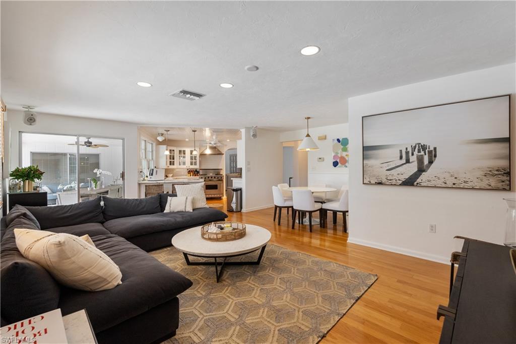 Image 4: Living room featuring ceiling fan and hardwood / wood-style floors
