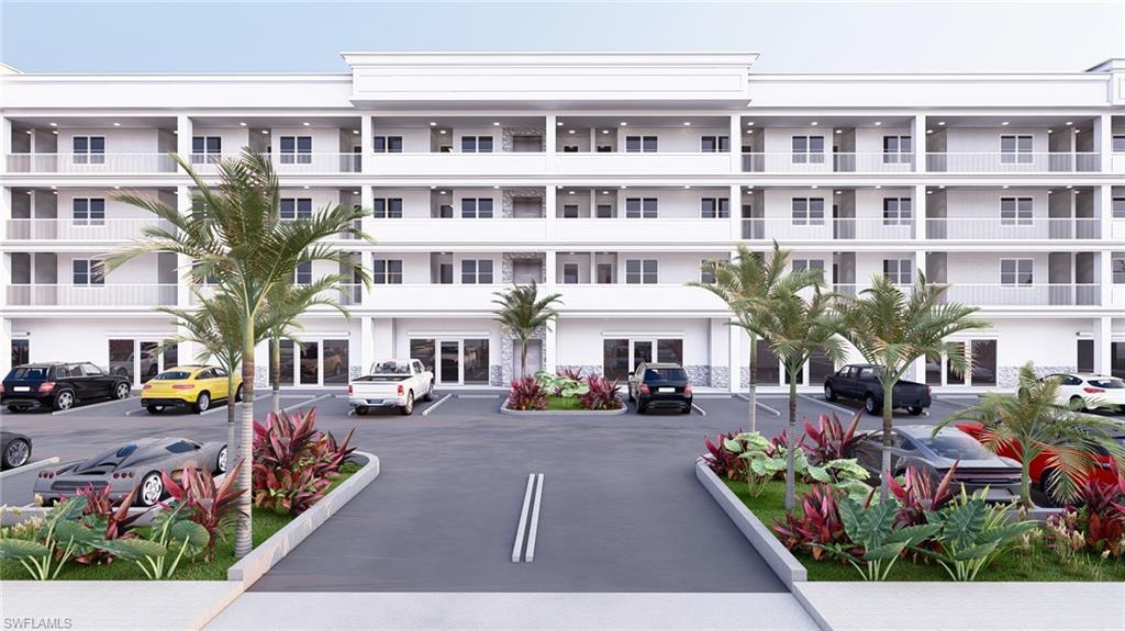 Image 3: View of apartment building / complex featuring uncovered parking