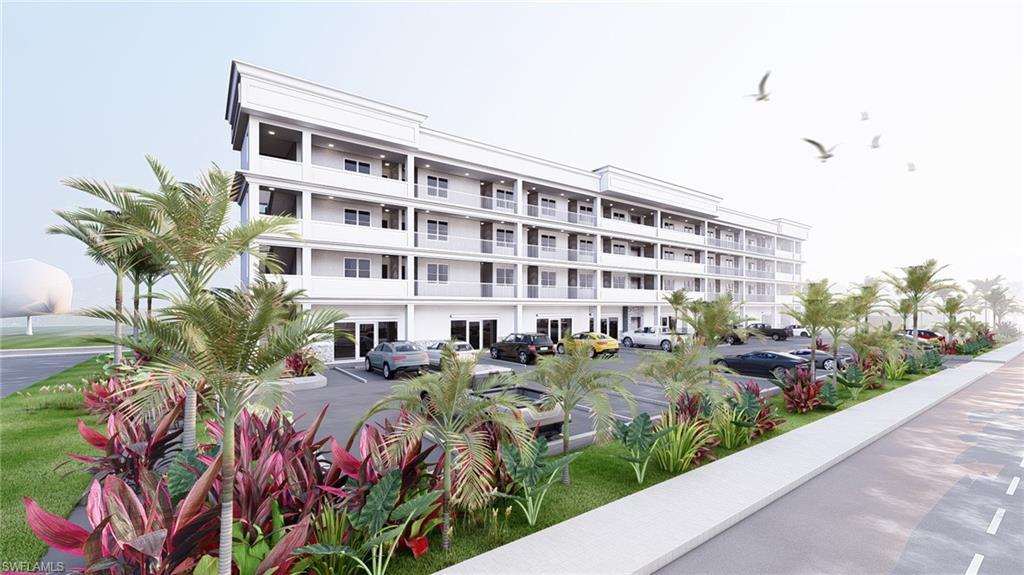 Image 4: View of apartment building / complex with uncovered parking