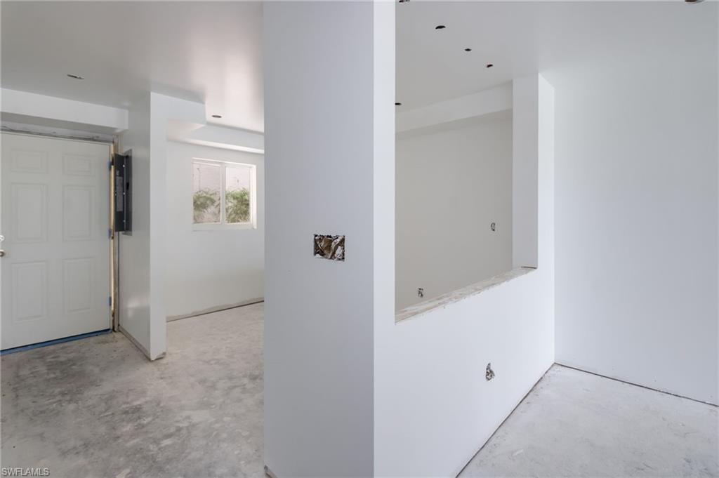 Image 3: Front door entrance and Kitchen
