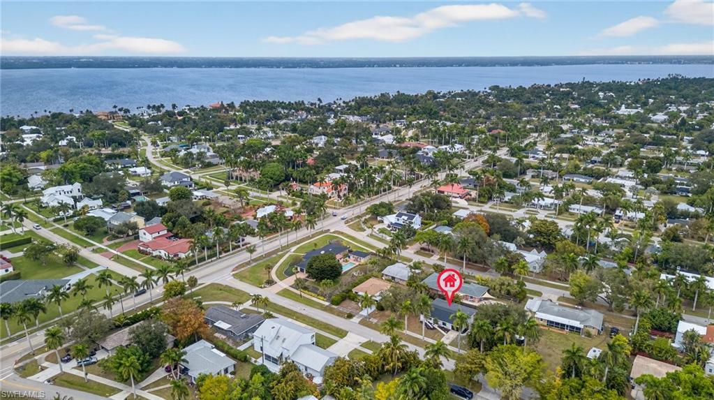 Image 2: Aerial view of property's location featuring nearby suburban area and a large body of water