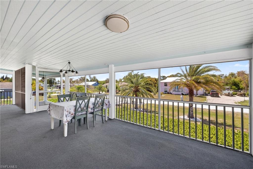 Image 3: Large, elevated, screened front porch for entertaining or just relaxing