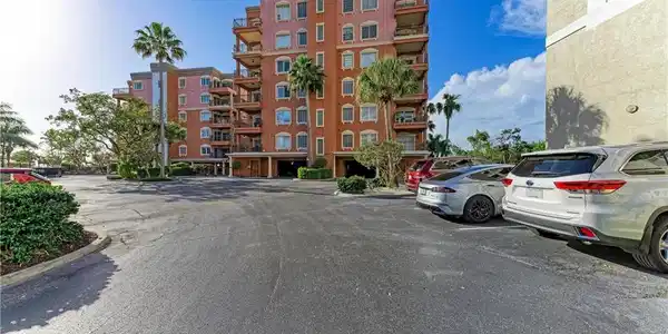 Image 2: View of apartment building / complex with uncovered parking