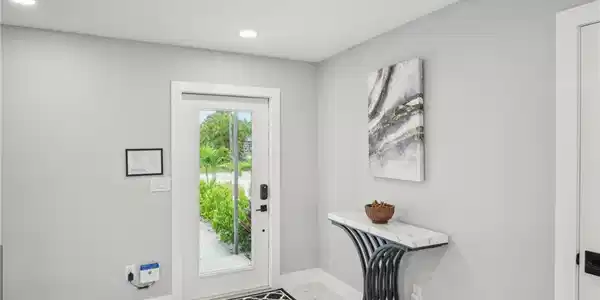 Image 4: Entryway with marble finish flooring and recessed lighting