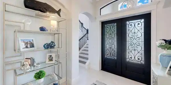 Image 3: Foyer with french doors, arched walkways, crown molding, and light tile patterned floors