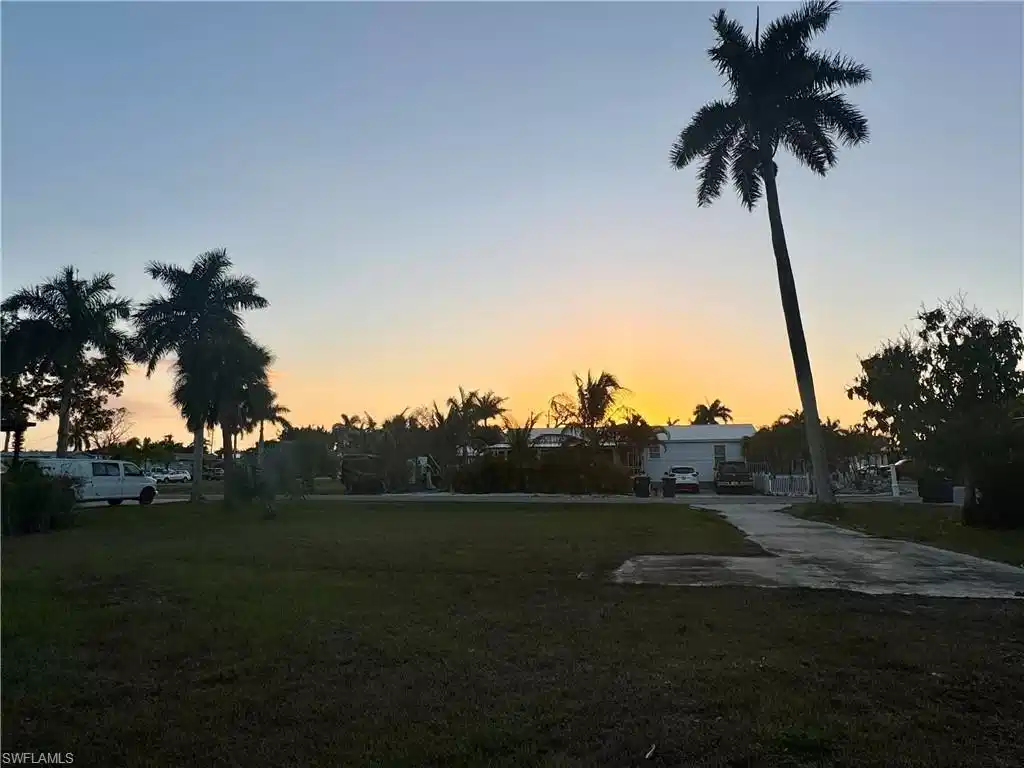 Image 1: Yard at dusk featuring a yard