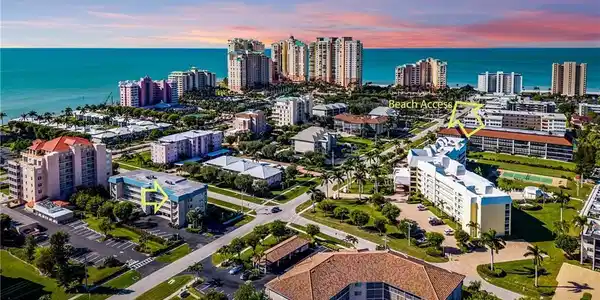 Image 3: Aerial perspective showcasing a coastal community with expansive ocean frontage
