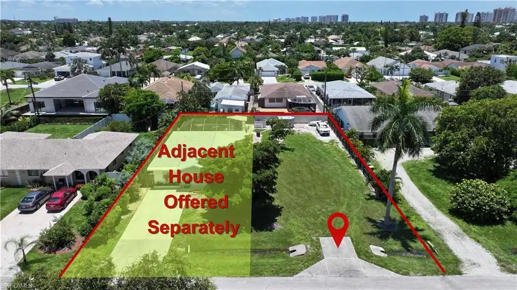 Image 1: Expansive undeveloped lot featuring a defined property boundary and direct road frontage