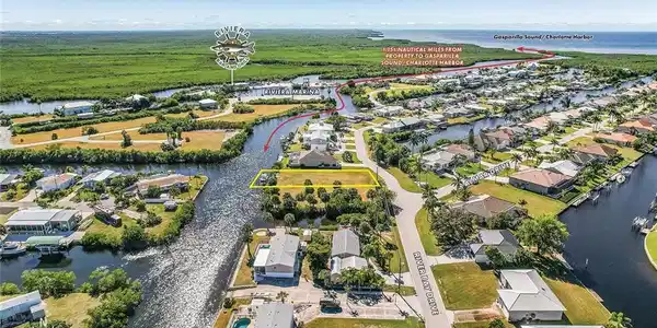 Image 3: Aerial perspective of suburban area featuring a large body of water