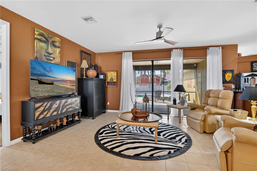 Image 3: Great room with sliders to screened lanai
