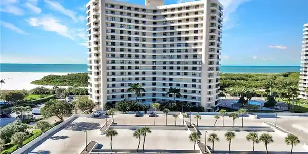 Image 2: View of apartment building / complex featuring a water view