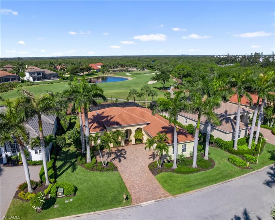 Image 2: Drone Shot of Home W/ Mature Royal Palms + Golf Course Back Drop