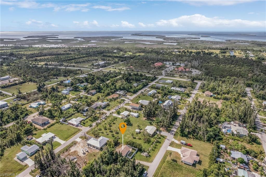 Image 1: Aerial perspective showcasing a residential area with varied housing styles and ample green space