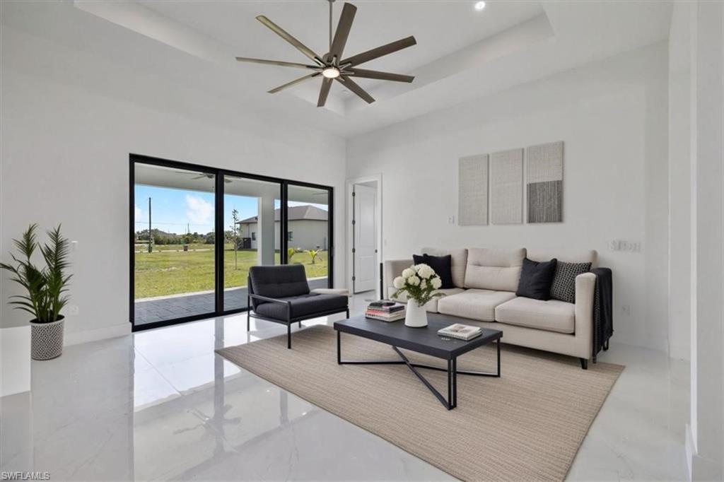 Image 3: Dining area with a high ceiling, a ceiling fan, visible vents, and recessed lighting