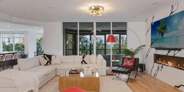 Image 4: Living area with a high-end fireplace, French Oak wood floors, and a ceiling fan
