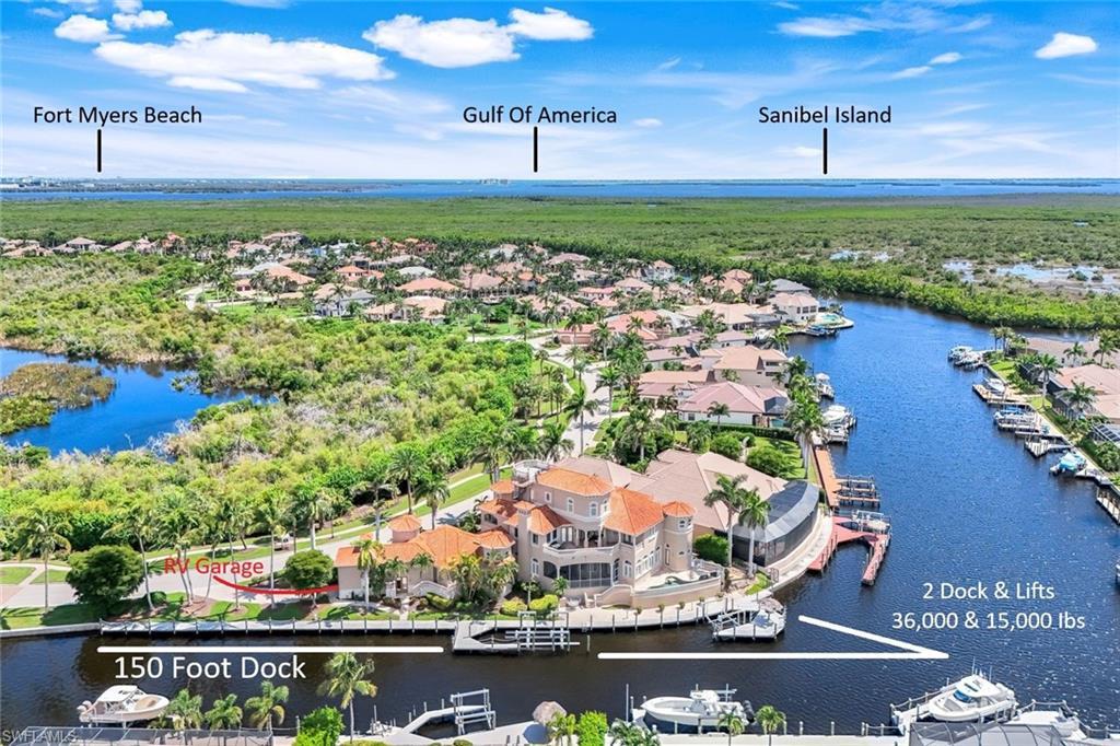 Image 2: 300 feet of prime waterfront featuring a 150-foot dock and two high-capacity boat lifts (36K and 15K).