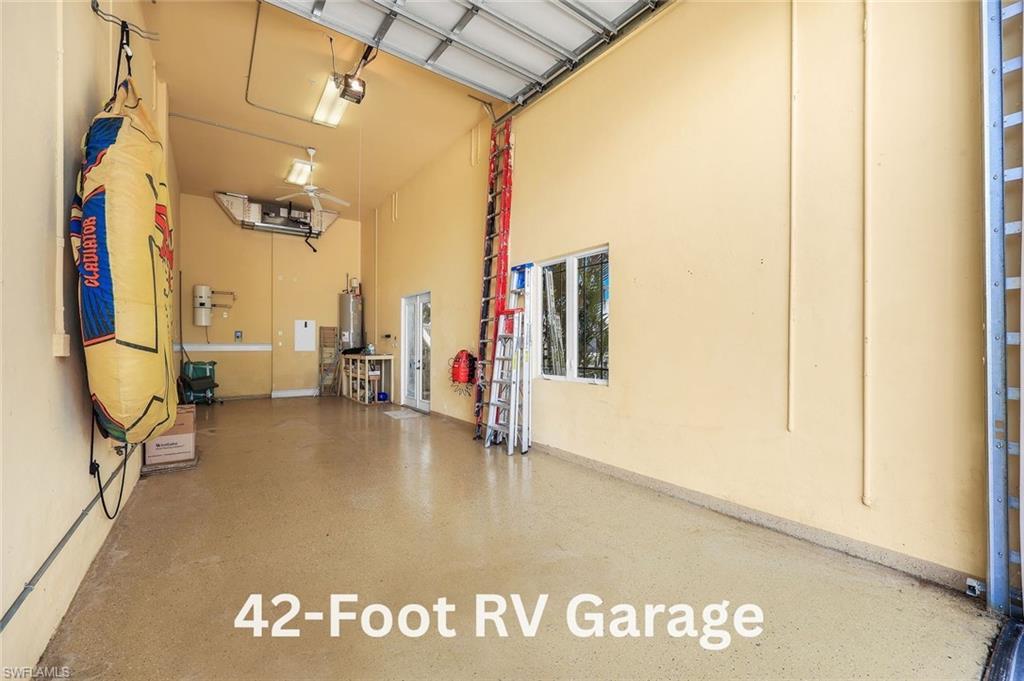 Image 3: Expansive 42-foot RV garage, perfect for a luxury motorcoach or accommodating 3 to 6 cars with lifts.