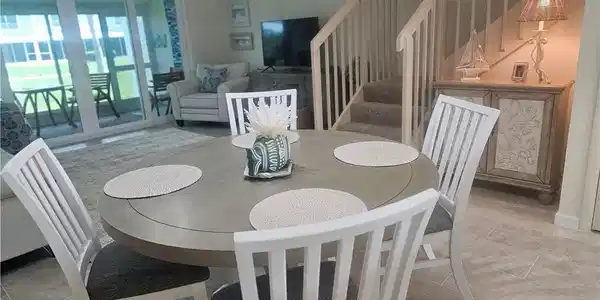 Image 3: Dining room featuring stairway and stone tile flooring