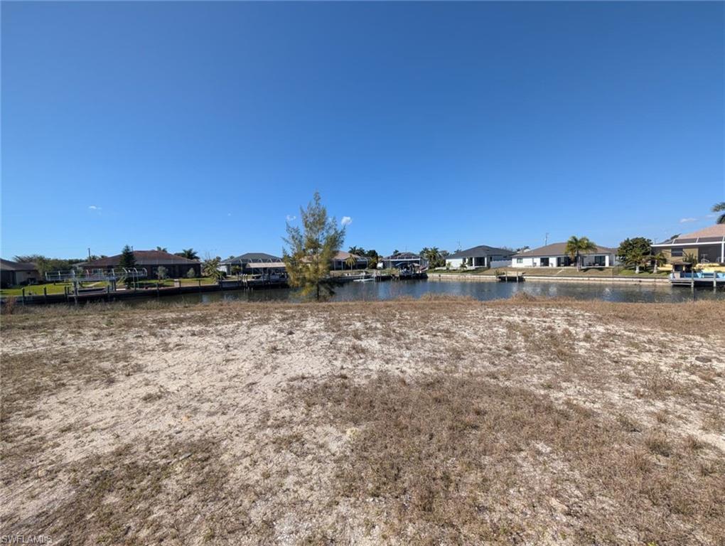 Image 4: View of yard with a residential view and a water view