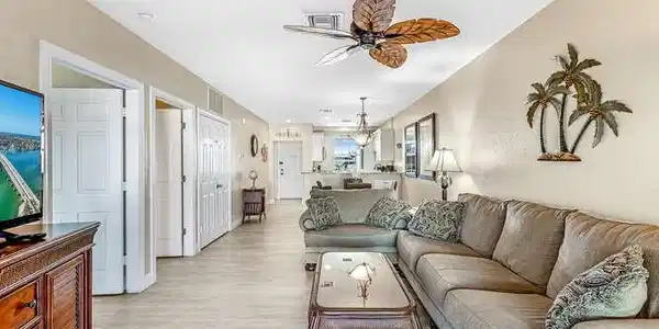 Image 4: Living area with a ceiling fan and light wood-type flooring