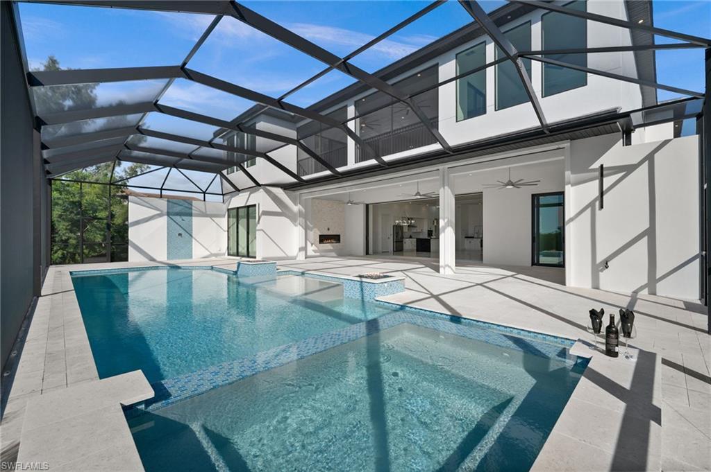 Image 4: Integrated pool / spa featuring a sunroom, a patio area, and a lanai