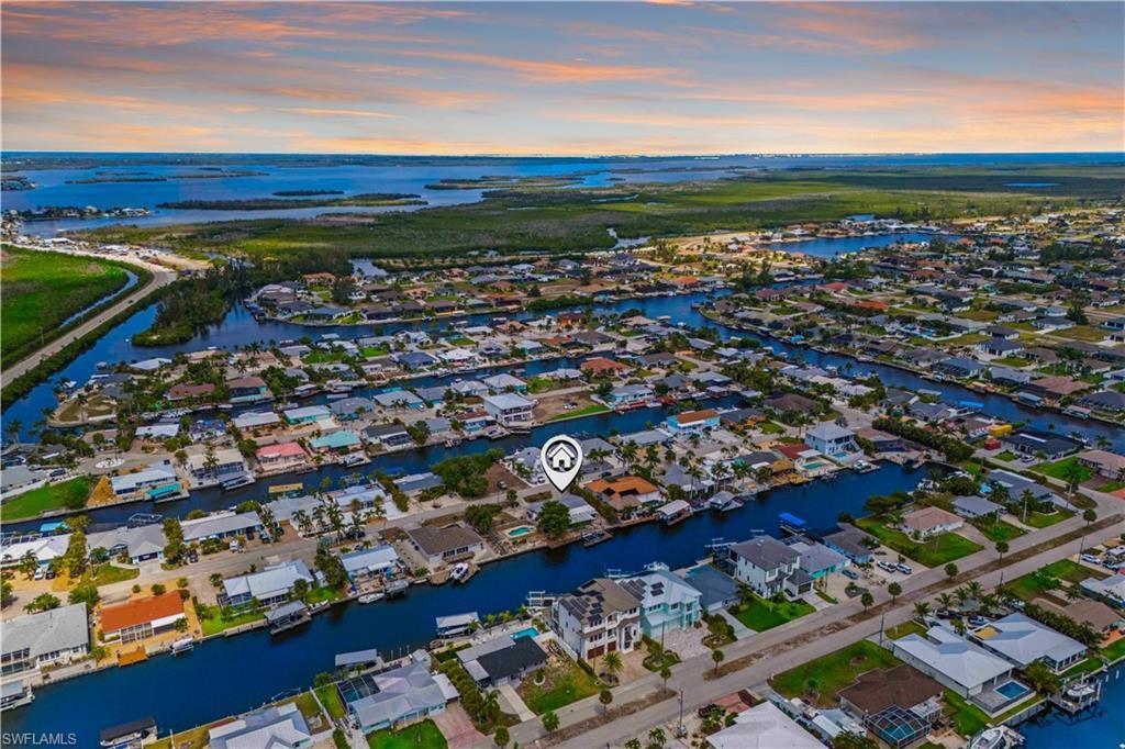 Image 1: Largest lot in the area with wide-open waterfront views.