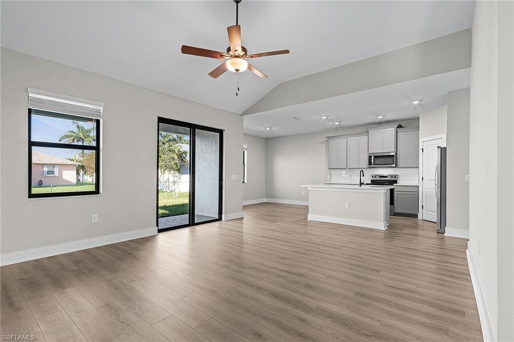 Image 4: Entrance foyer with baseboards and wood tiled floors