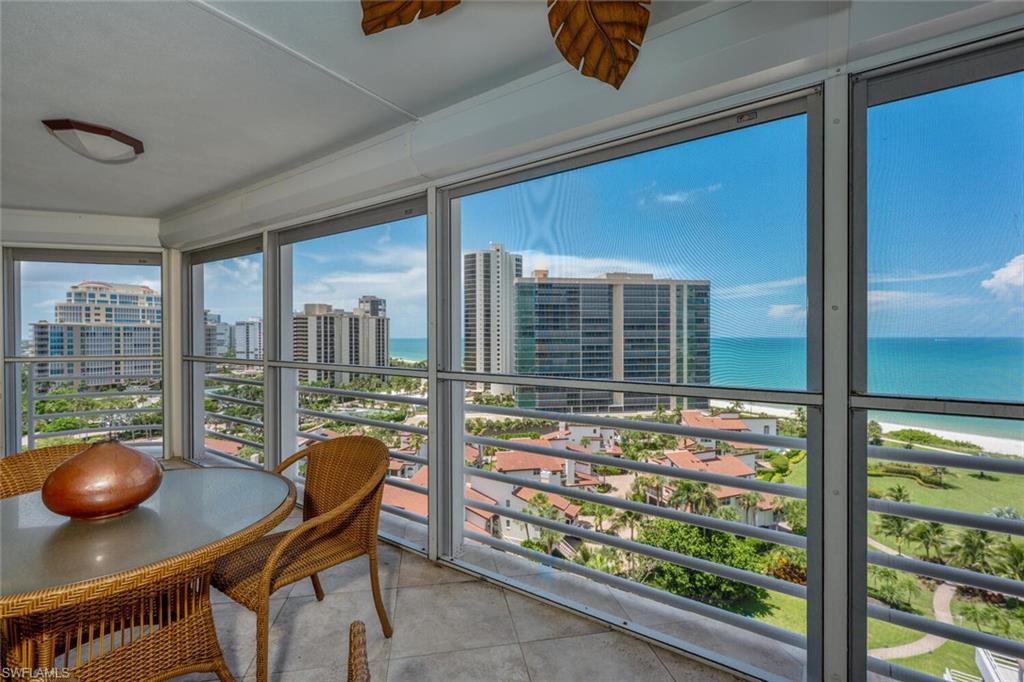 Image 3: Sunroom / solarium featuring a city view and a water view