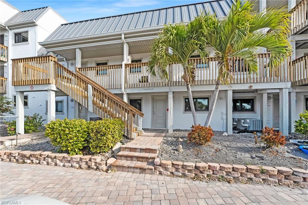 Image 3: Completely remodeled, bayfront, and move-in ready &mdash; this condo captures relaxed island living from every angle.