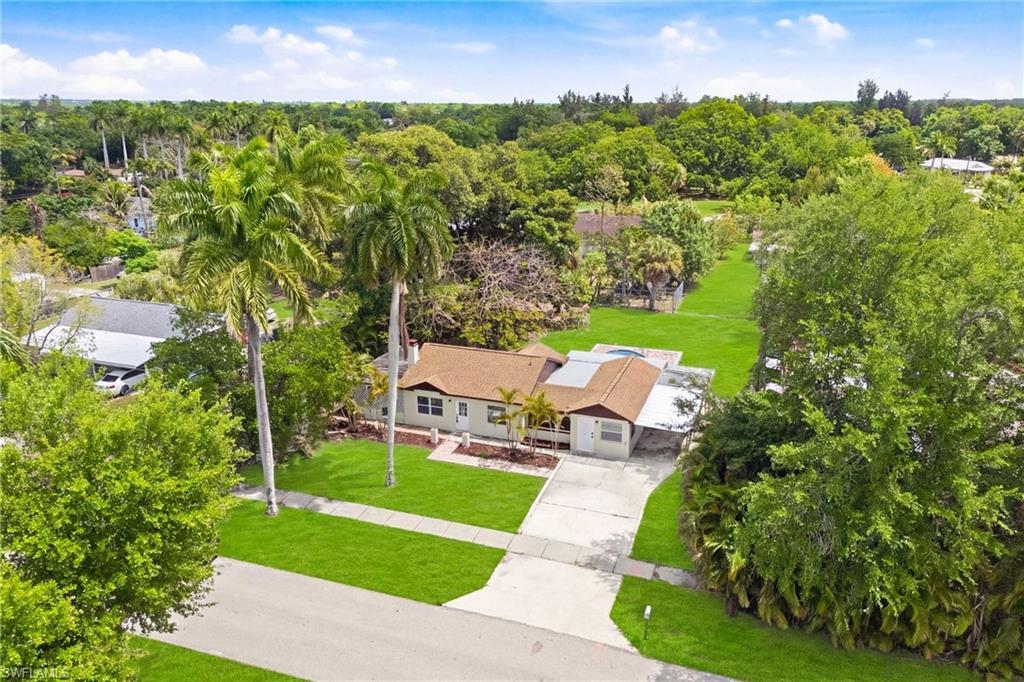 Image 2: Beautiful overhead shot highlighting the front of the residence, curb appeal, and surrounding lot.