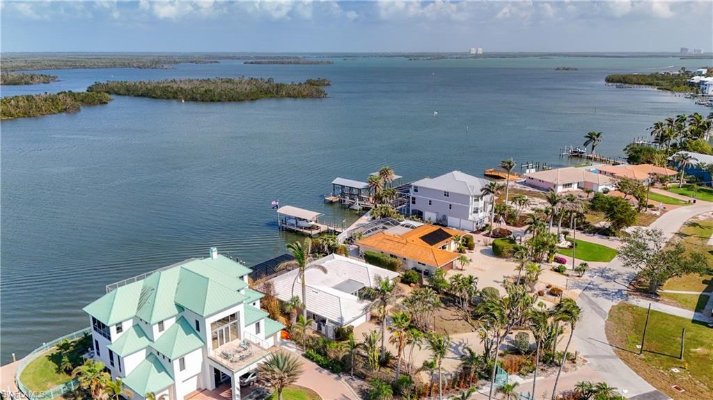 Image 2: Aerial of beautiful bay at this homes back door